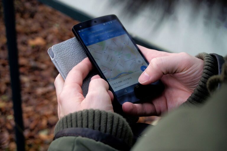 Person checking Google Maps and local business search results on a smartphone